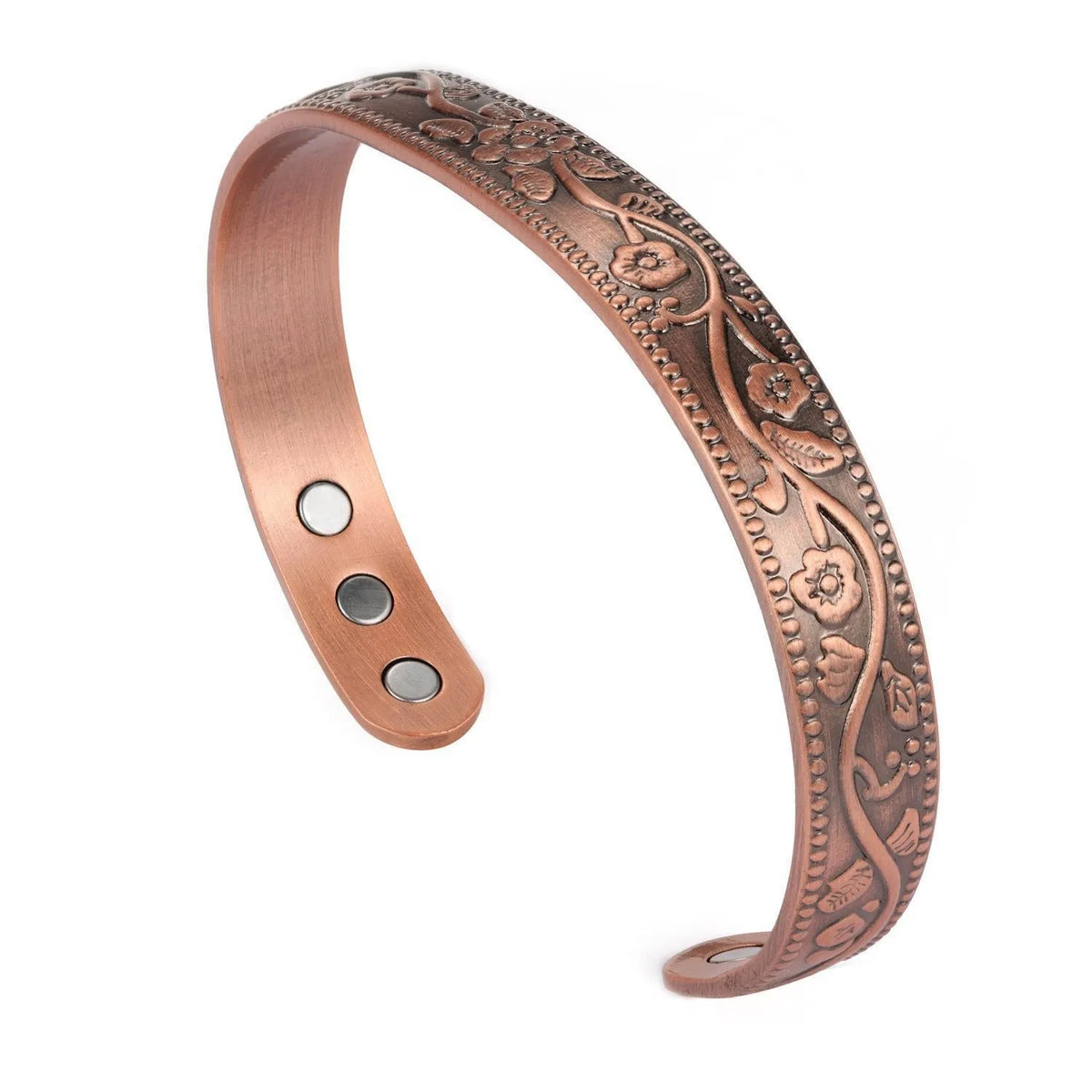 Bracelet couleur cuivre avec gravures florales complexes et petits accents ronds.