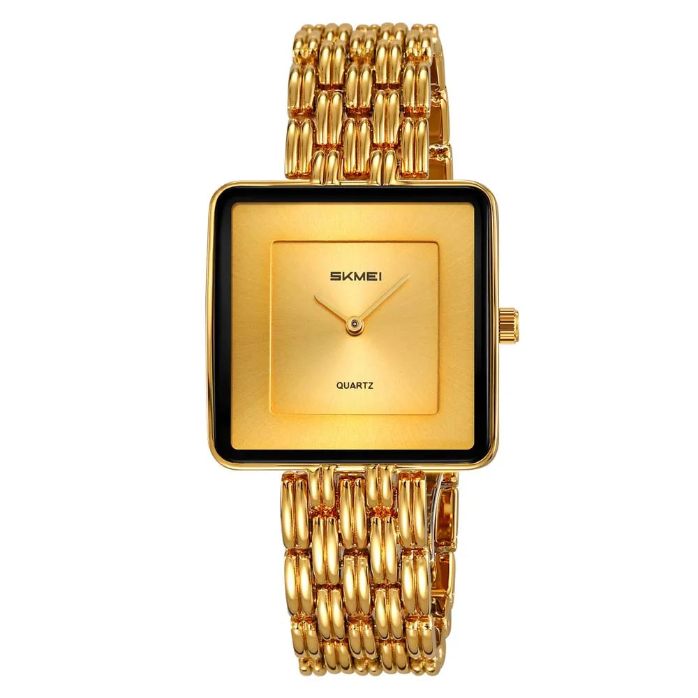 A gold-toned minimalist quartz wristwatch with a square face and metal link bracelet.