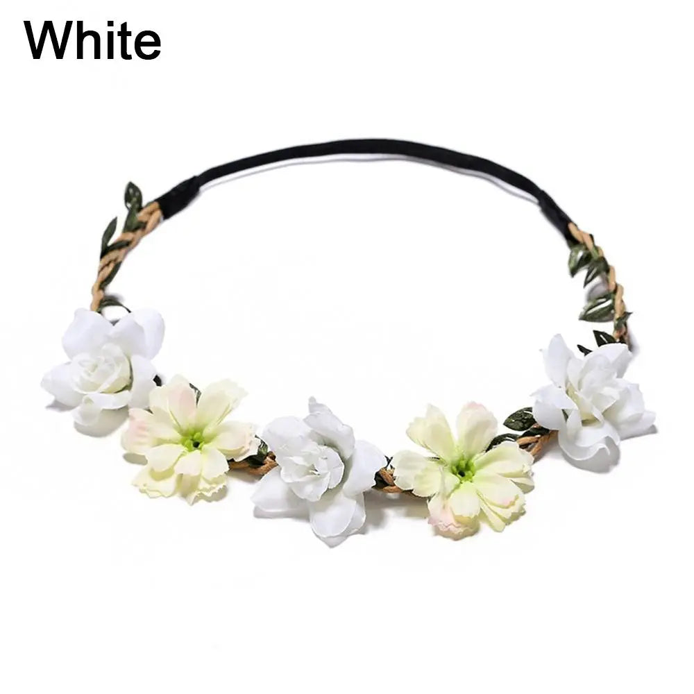 A white bohemian flower headband made of dried natural elements and fabric.