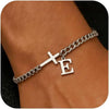 A close-up of a personalized stainless steel cross Cuban chain bracelet worn on a wrist.