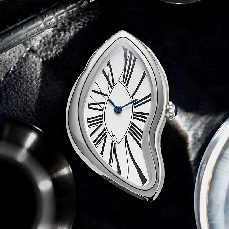 A silver-toned fashion quartz wristwatch with a white dial and Roman numerals is shown against a dark, textured background.