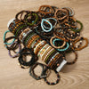 A collection of various fashion elastic wood bead bracelets in earthy and natural tones.