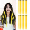 A woman shows off long, straight black hair extensions with bright yellow tips.
