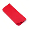 A vibrant red PU leather glasses case folded and displayed against a white background.