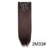 A bundle of long, straight, dark brown hair extensions with metal clips for natural styling.