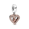 Rose gold cherry blossom charm pendant with a heart shape and a silver bail.