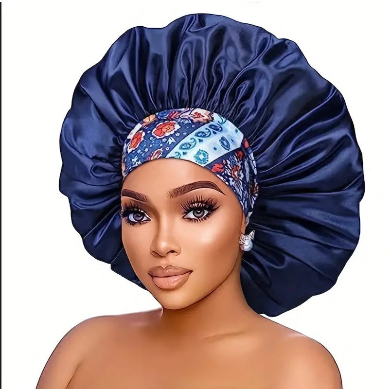 A woman wearing a dark blue satin sleep bonnet with a patterned elastic band