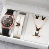 A white box contains a rose gold watch, a gold butterfly necklace, and a gold butterfly ring.
