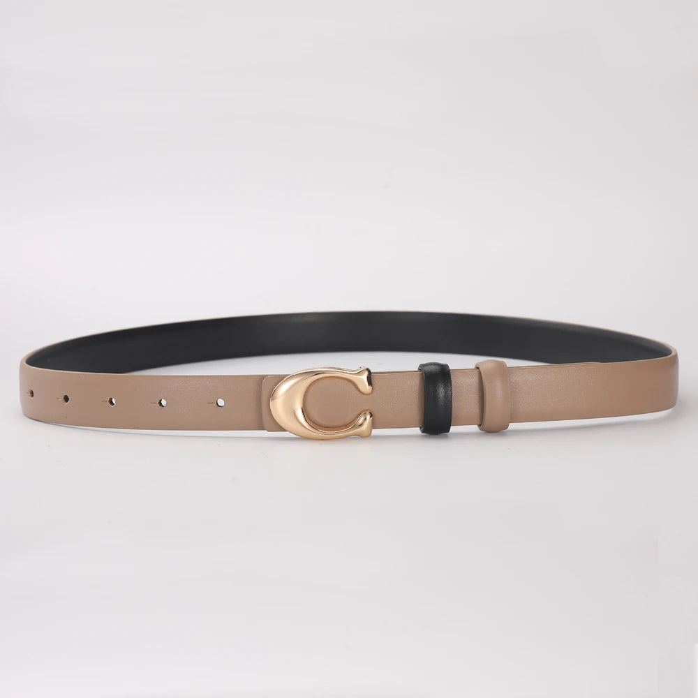 A women's smooth double-sided belt in tan leather with a gold C-shaped buckle and black accents.