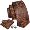 A set of men's silk jacquard ties in brown and gold paisley patterns rolled together.