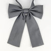 A gray classic butterfly ribbon tie set for students with a bow design.