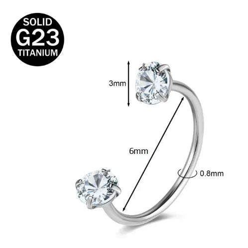 A close-up view of a solid titanium G23 nose ring with a clear crystal setting.