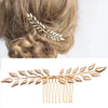 Gold leaf hair accessory featuring a delicate laurel branch design for bridal or party use
