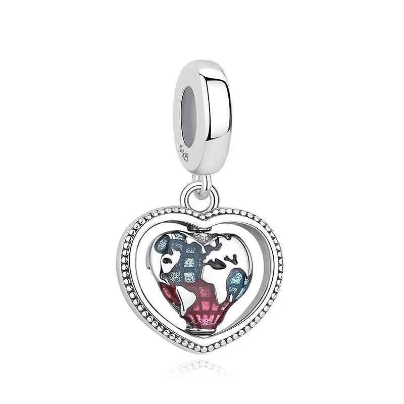 A silver heart pendant featuring a detailed family tree design.