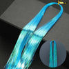 Long, bright blue glitter hair extensions shown in a bundle with gold clasps.
