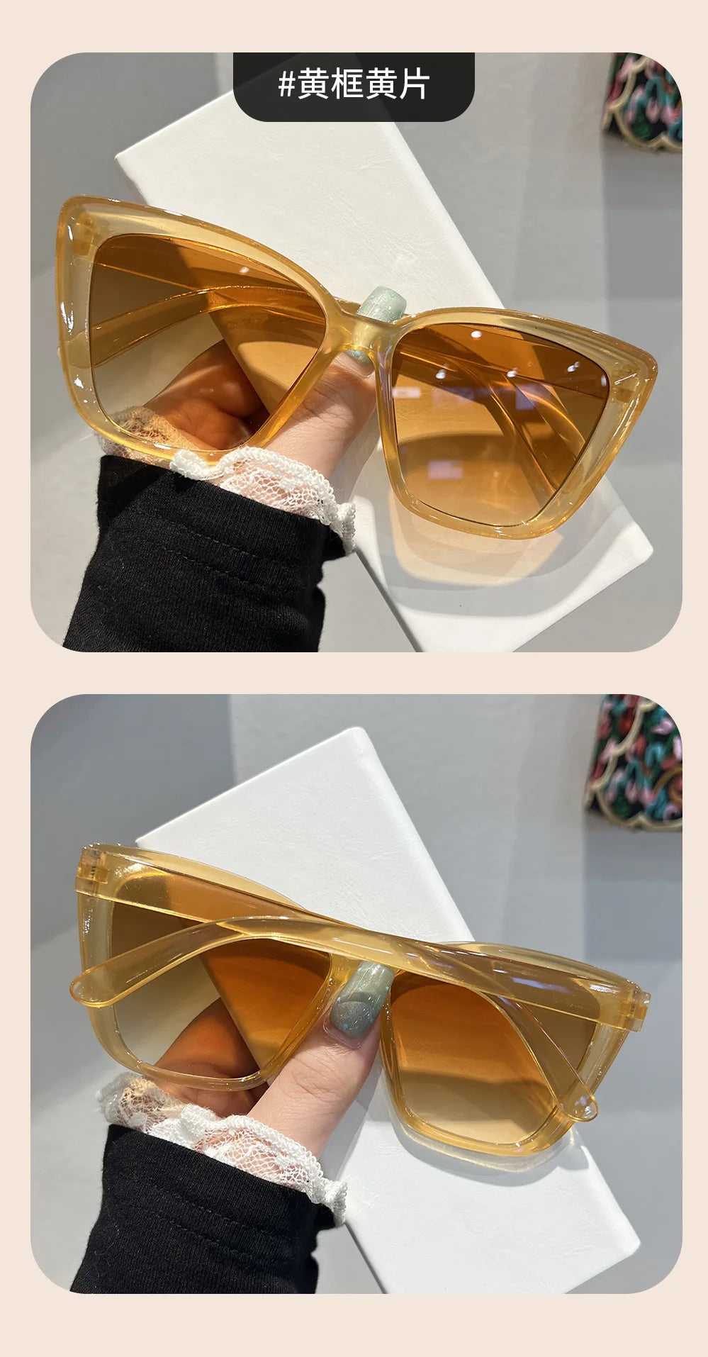 A pair of amber-tinted retro cat eye sunglasses being held by a hand against a white background.