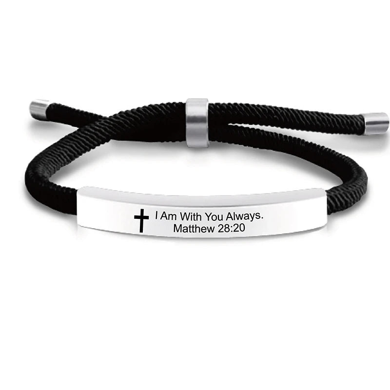 Black cord bracelet with a silver bar and a white plaque engraved with Matthew 28:20