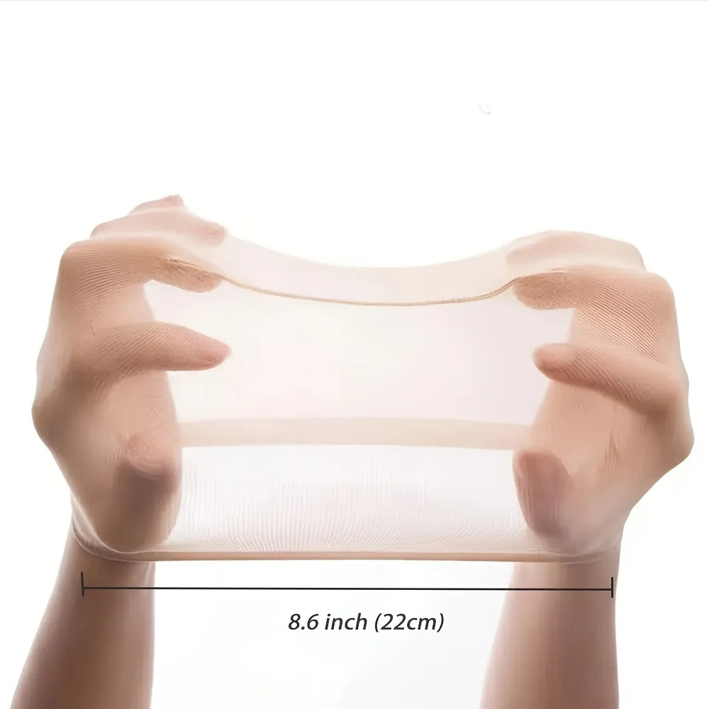 Hands holding a clear stretchy non-slip wig cap measuring 8.6 inches.