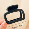 A black square lightweight hair claw clip is shown being held by a hand, with a measurement of 5cm/1.97in visible.