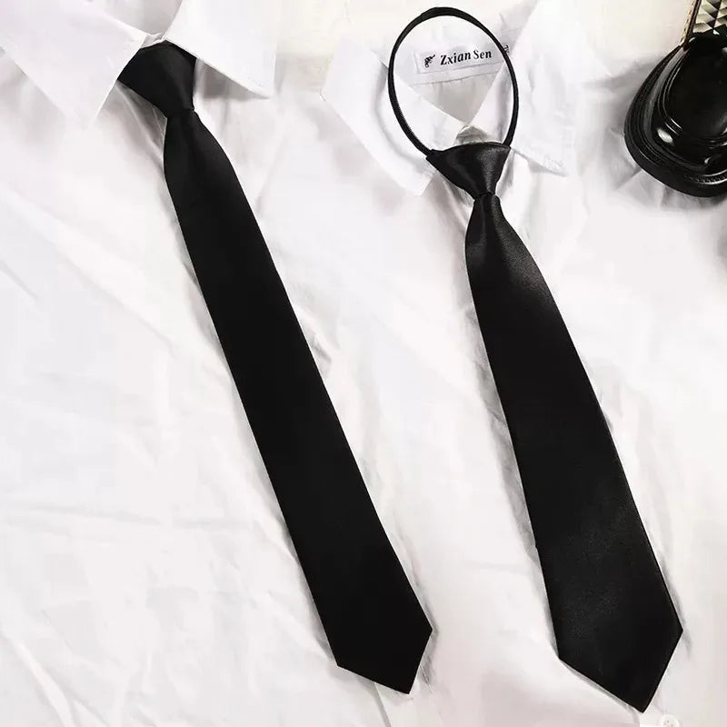 A black clip-on security tie is displayed against a white shirt.