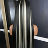 A long straight lace front wig with black and white highlights displayed against a dark background.