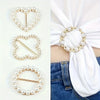 A collection of elegant rhinestone and pearl decorative button clips in gold tone against a white background.
