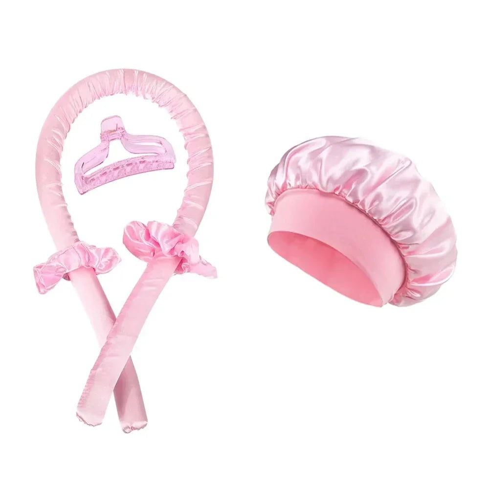Pink set of no-heat hair rollers and styling tools with a pink hair cap