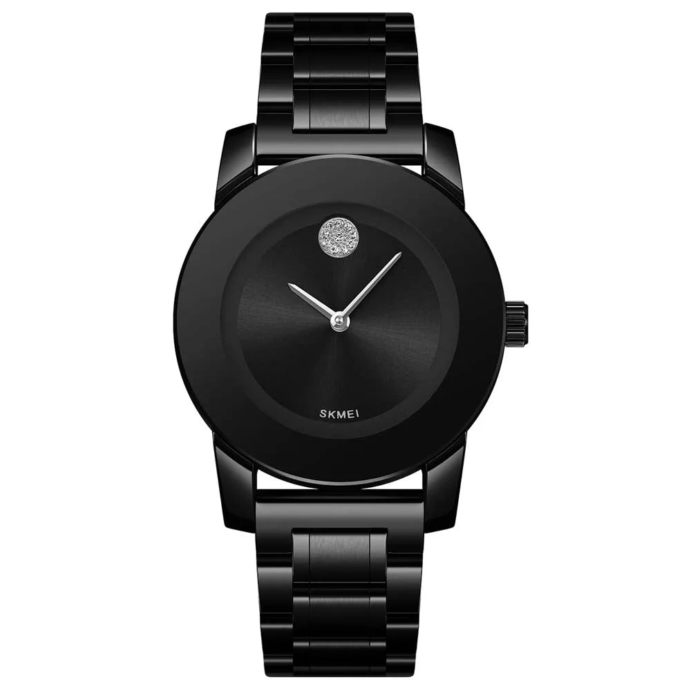 A black minimalist quartz wristwatch with a round face and silver hands on a black strap.