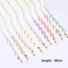 Multiple strands of fashion pearl beaded eyewear chains in pastel pink and blue colors