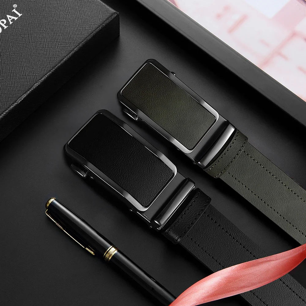 A black leather belt and watch strap are displayed on a dark surface with a pen.