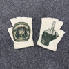Pair of white fingerless knit gloves with a dark print of a hand and a finger pointing