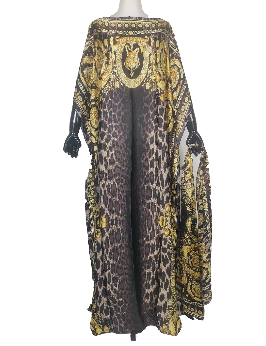 Elegant printed silk kaftan dress featuring a black and gold leopard print design